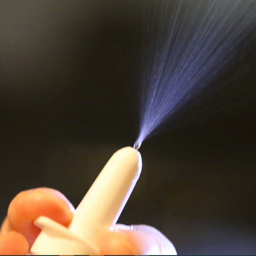 nasal spray device spraying